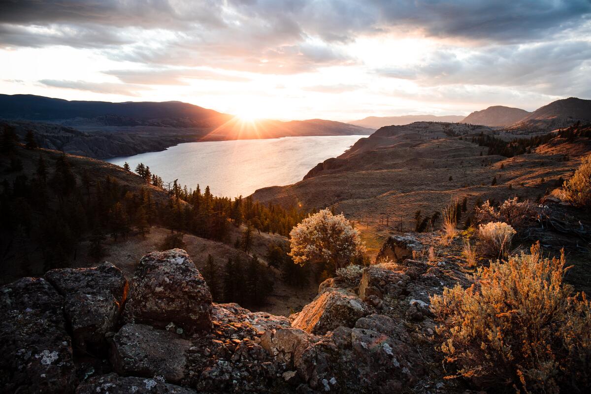 Small-1200px-Rocky Ridge outlook over a valley lake in Kamloops Overland in Kamloops